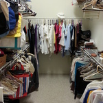 closet with only partial selection of clothes